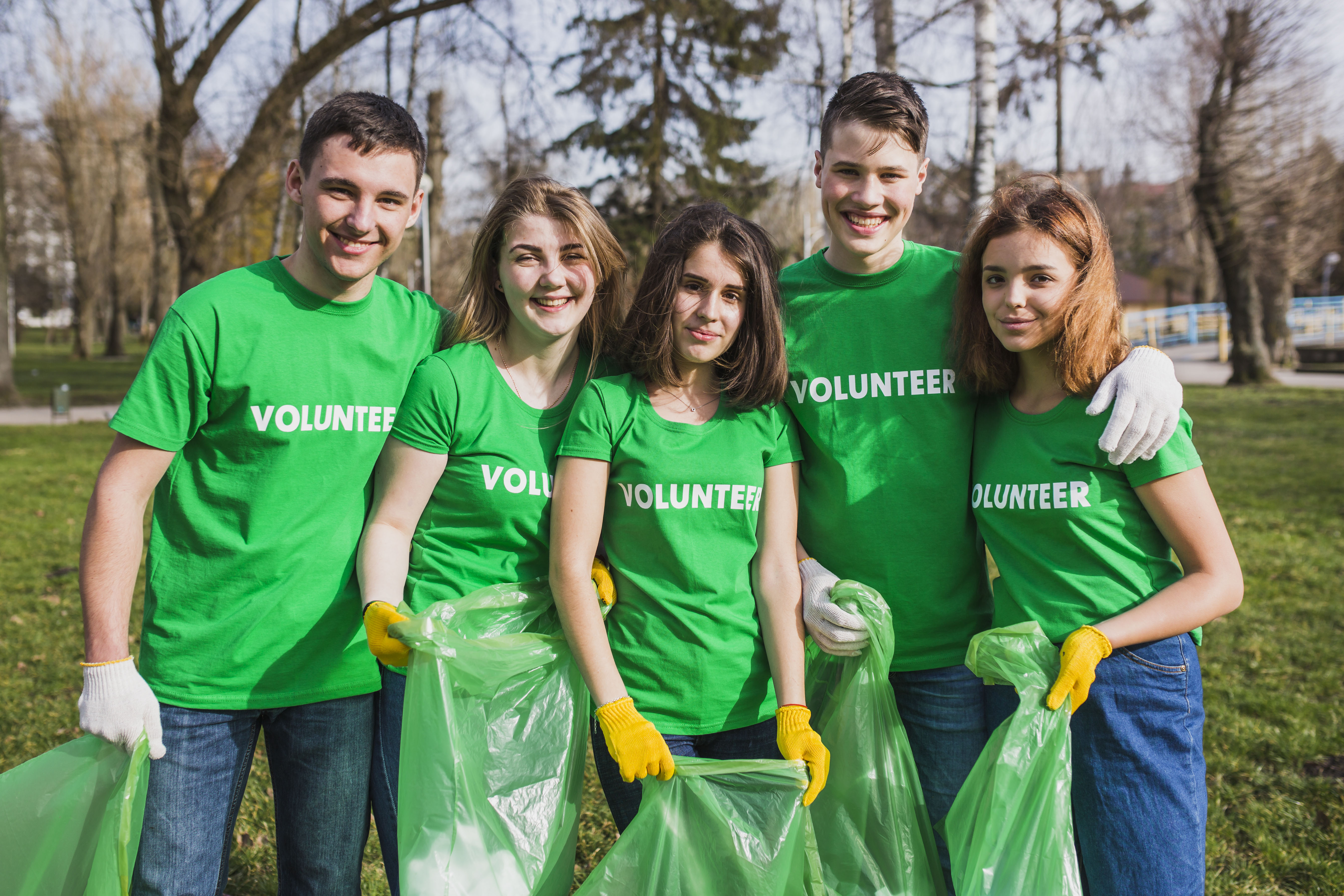 volunteers smiling at the camera